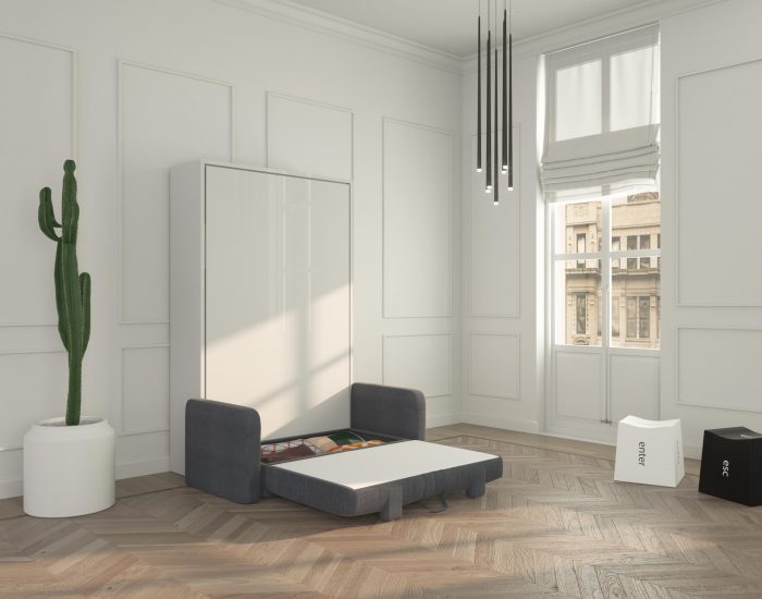 Un divano letto a scomparsa con pratico contenitore sotto la seduta