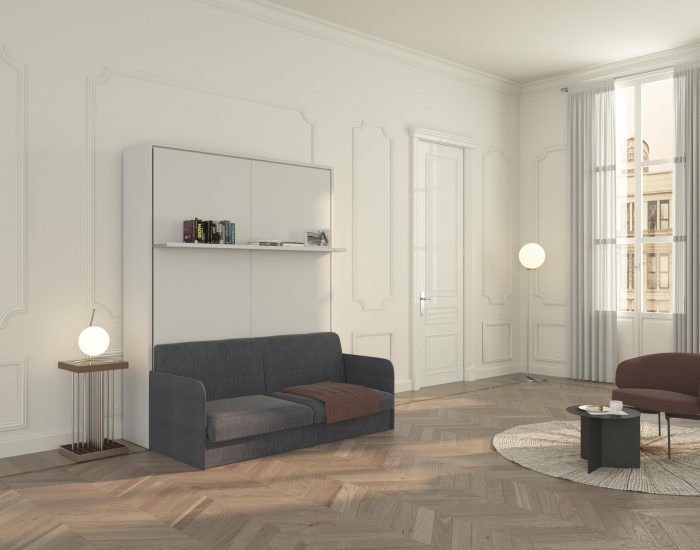 Letto a scomparsa matrimoniale con divano e ripiano d’arredo, per avere in un unico ambiente zona living e notte