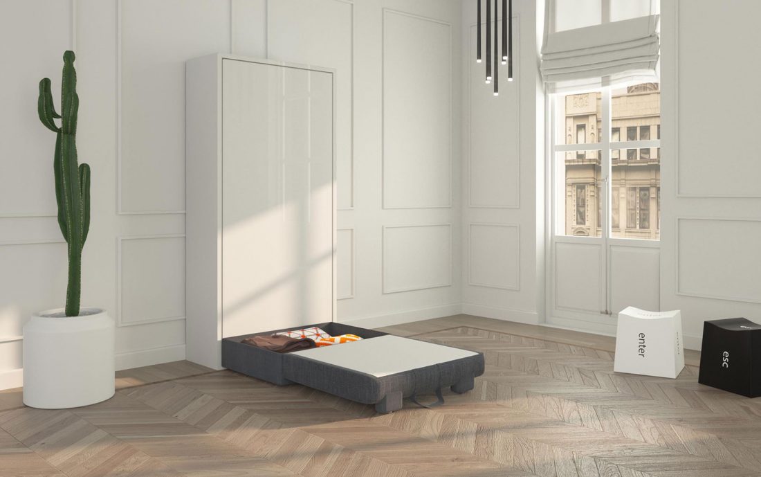 Il vano contenitore del pouf poltroncina con letto a scomparsa verticale